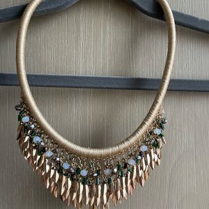 Gold cord necklace with gold and bead accents